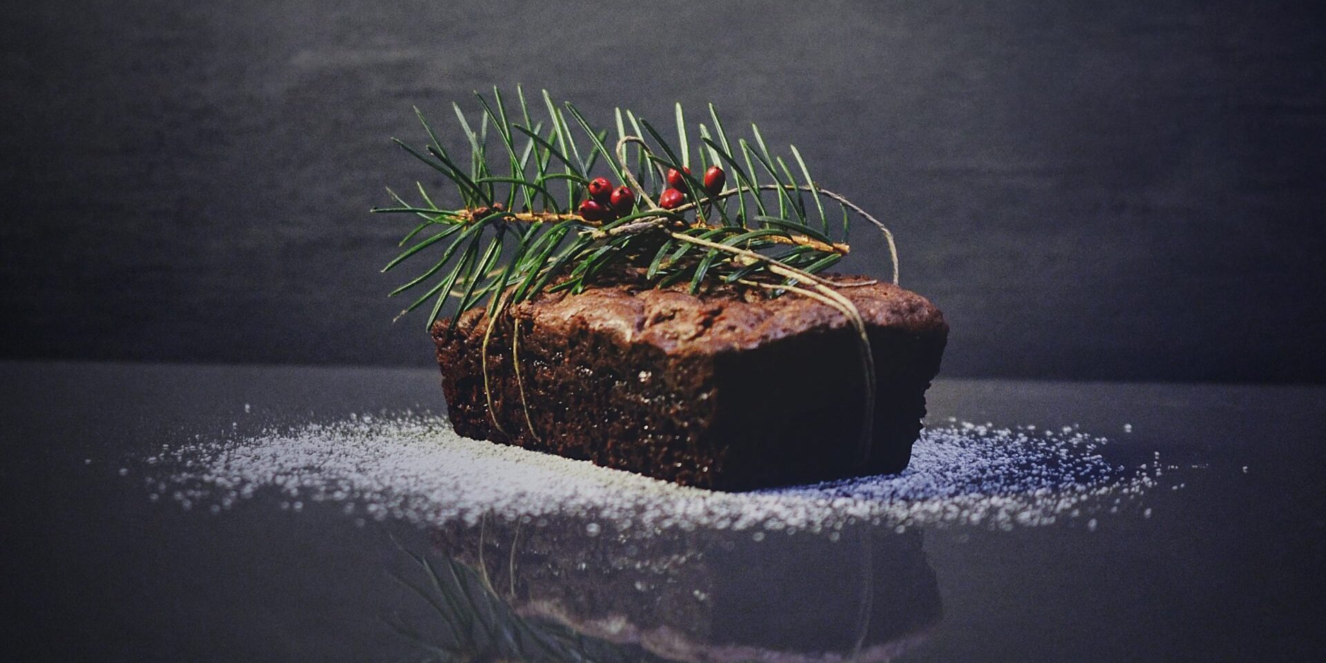 festive food: a christmas fruit loaf with a sprig of holly on top