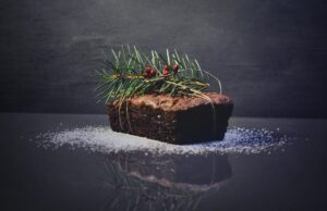 festive food: a christmas fruit loaf with a sprig of holly on top