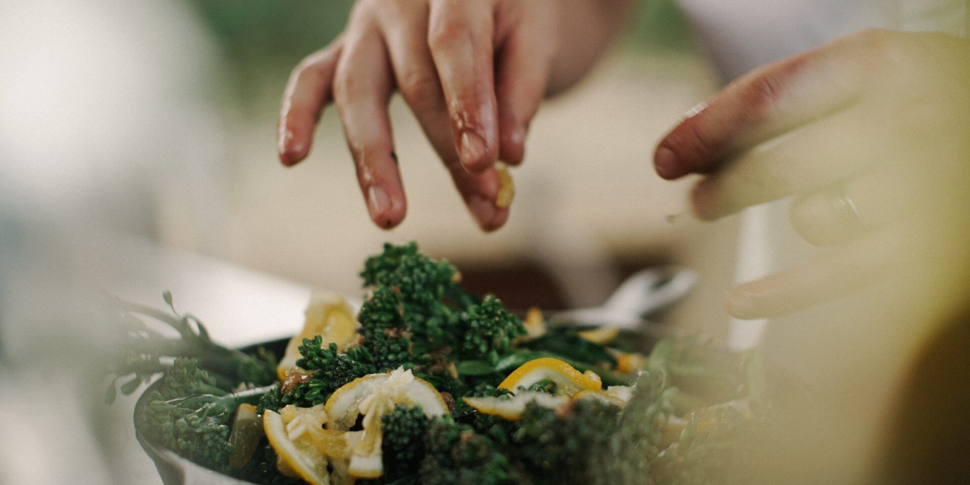 A chef preparing salad with kale and lemon – Compass Group jobs